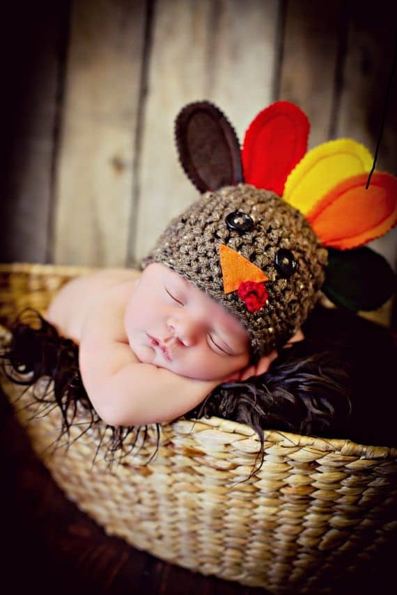 newborn baby sleeping in basket on thanksgiving