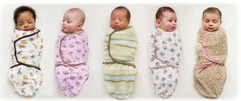 5 newborn babies sleeping in swaddle me swaddles