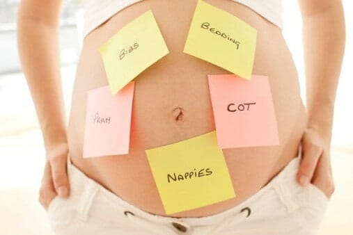 pregnant mom with sticky notes on her belly