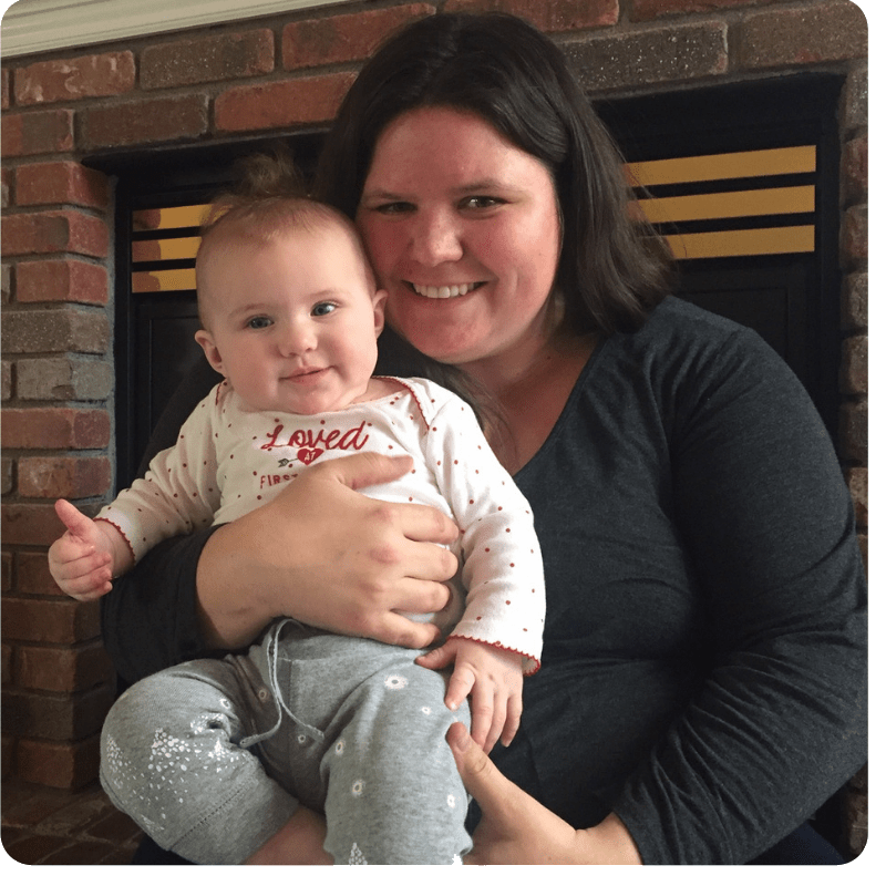 a well rested mom holding baby