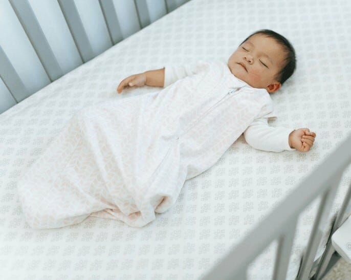 newborn baby in crib