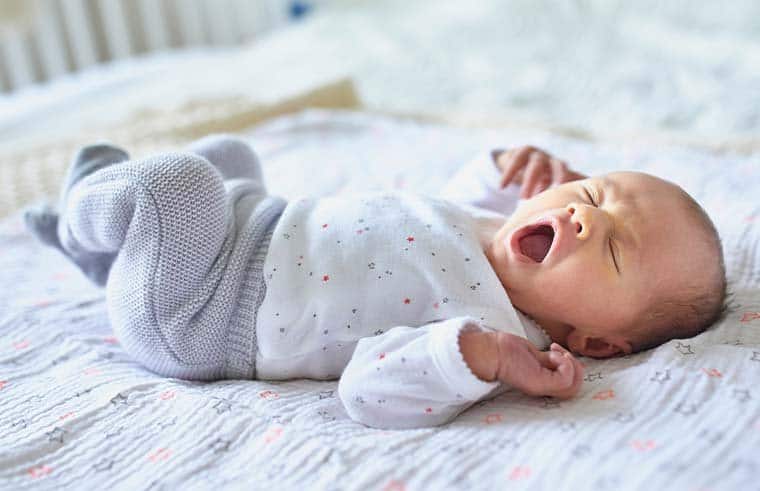 newborn baby preparing for sleep