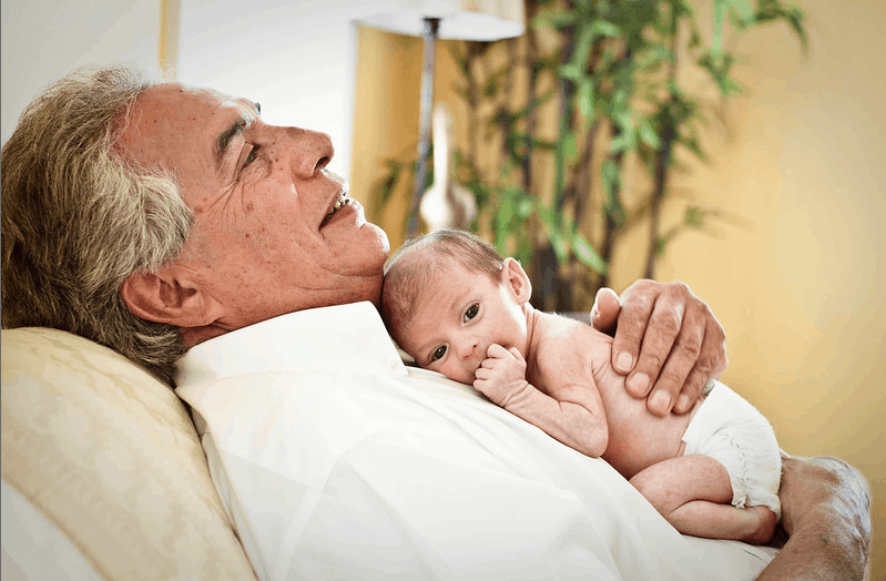 Grandfather with newborn baby