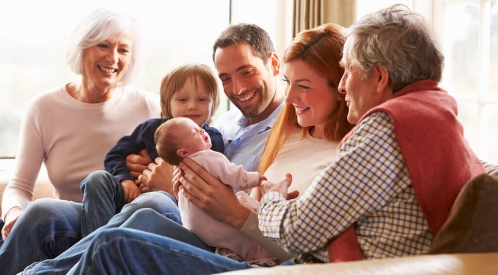 Family and grandparents with new baby