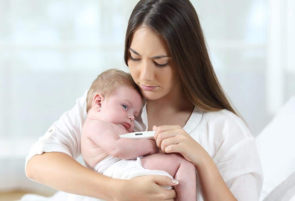 new mom taking baby's temperature