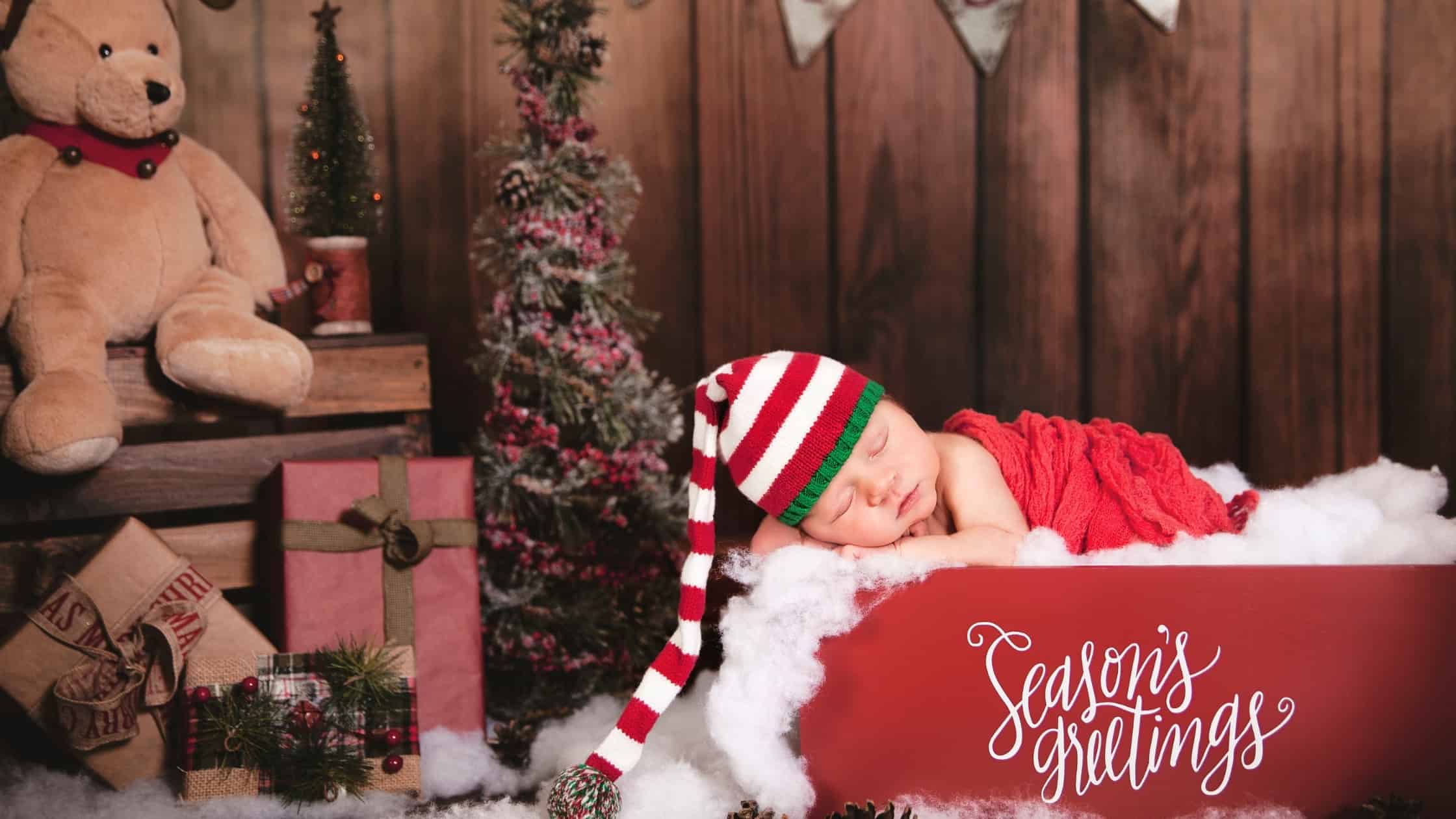 baby asleep in tub holiday decorations around