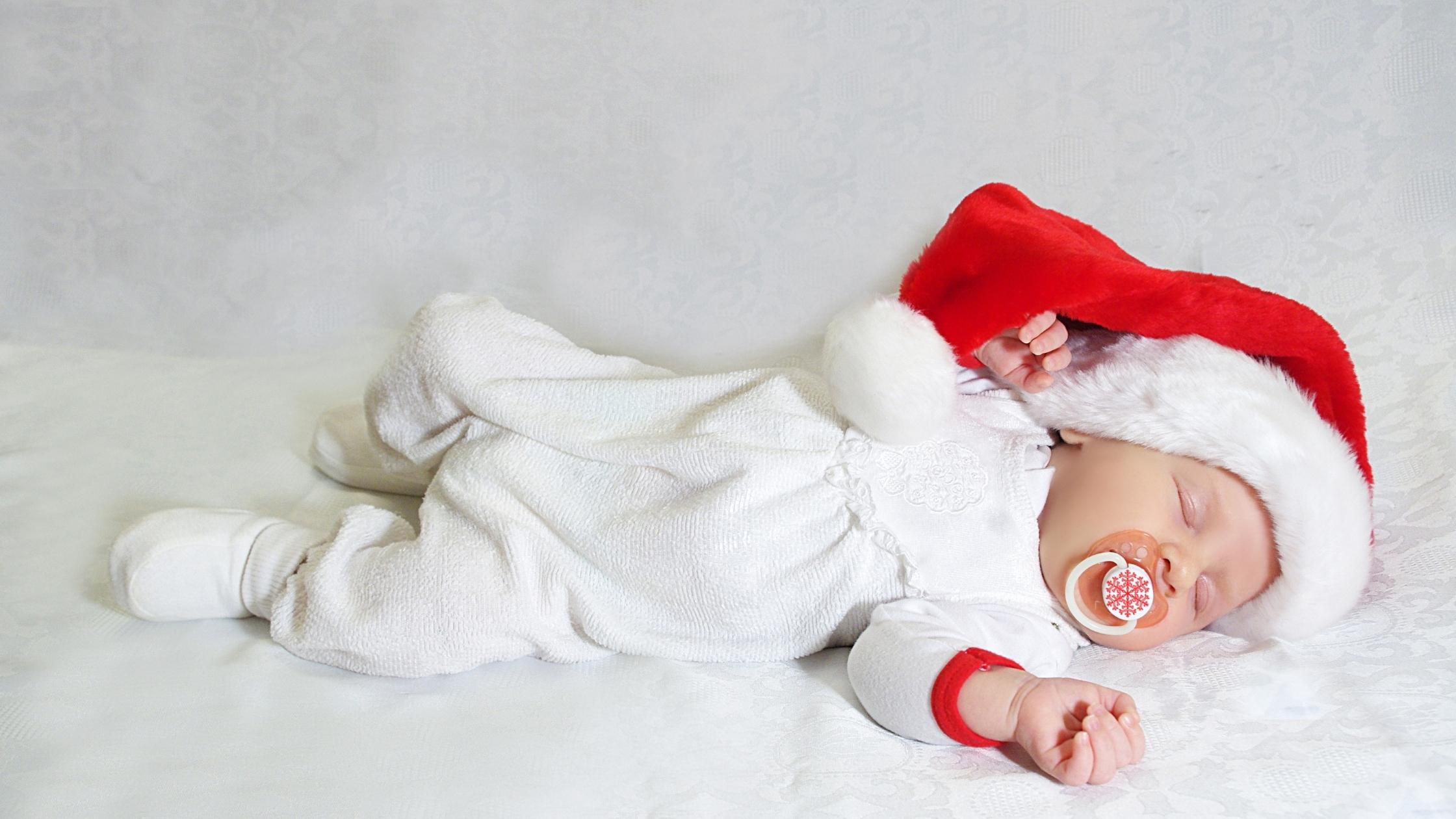 Baby with santa hat sleeping