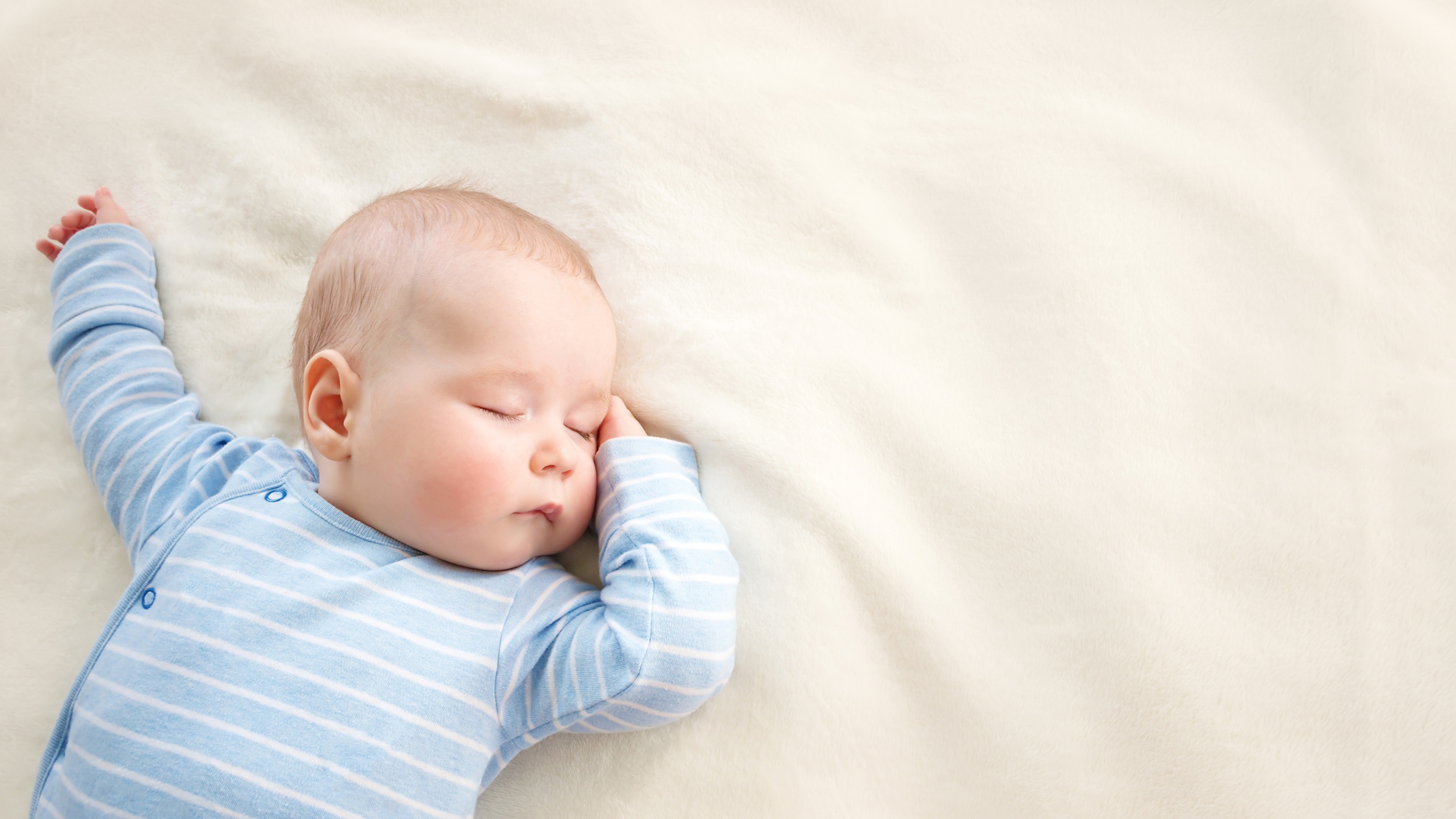 sleeping baby in blue