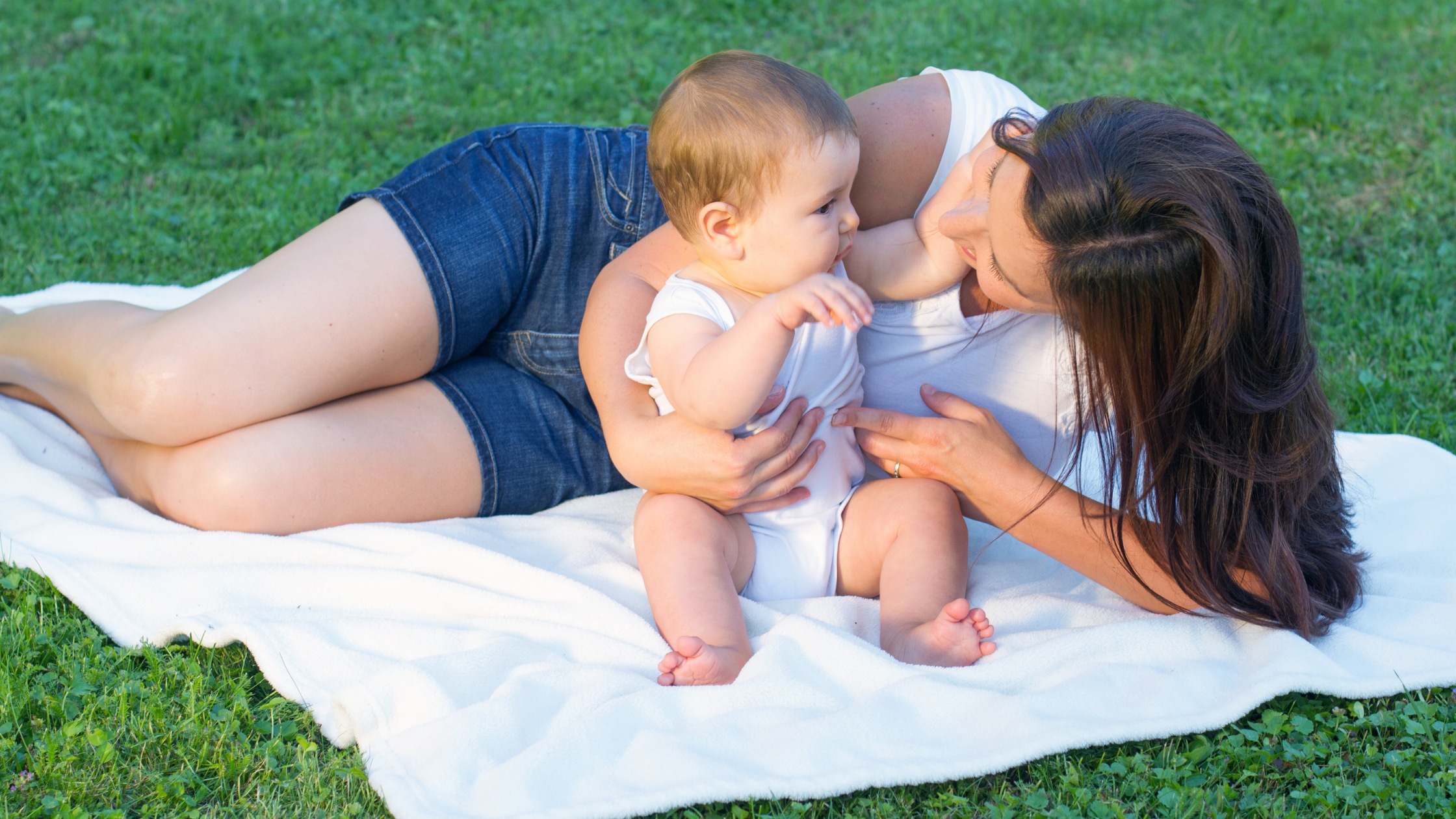 mom and baby outside blanket