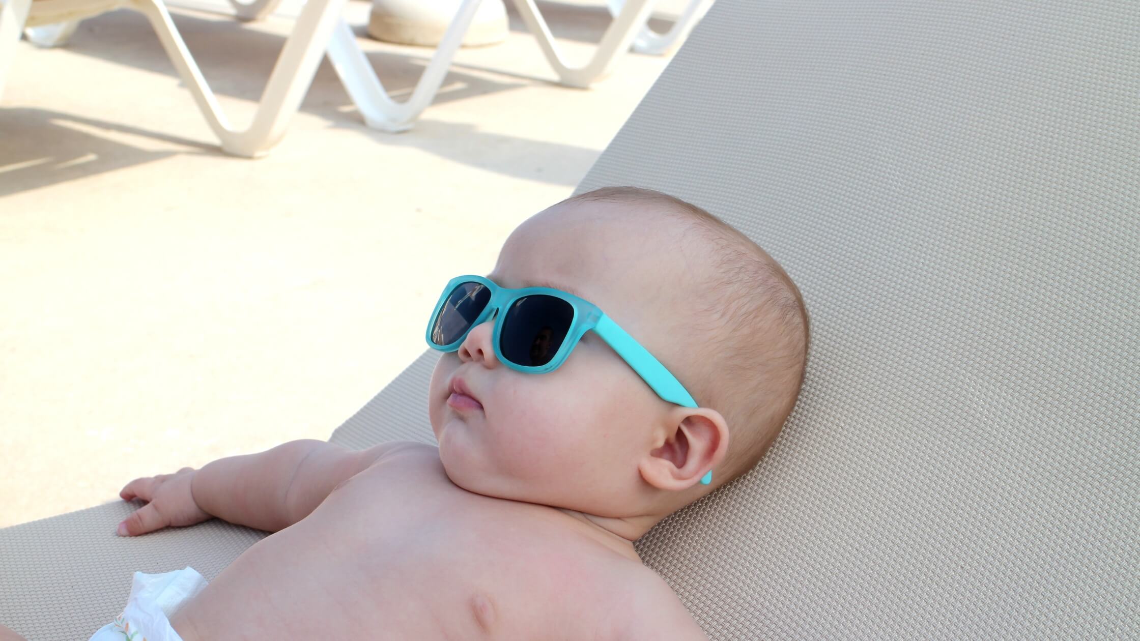 baby sleeping in summer sunglasses