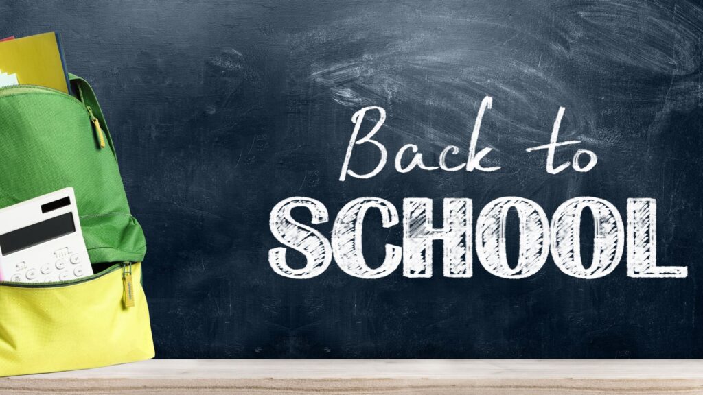 blog banner 2023 (2) (1) aug back to school written on a chalk board with school supplies near
