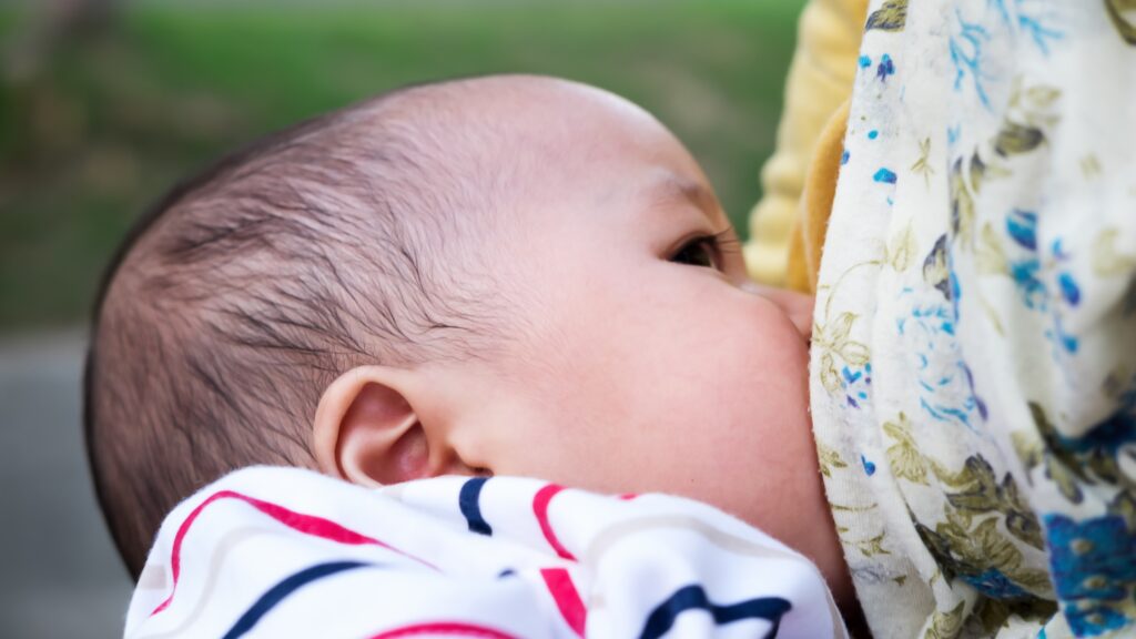 newborn nursing baby