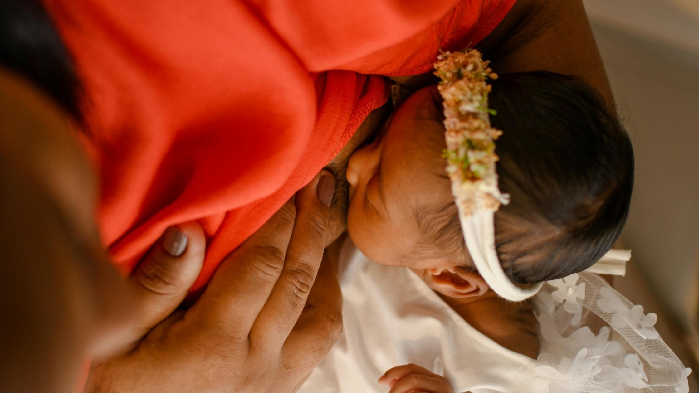 mom breastfeeding baby at night