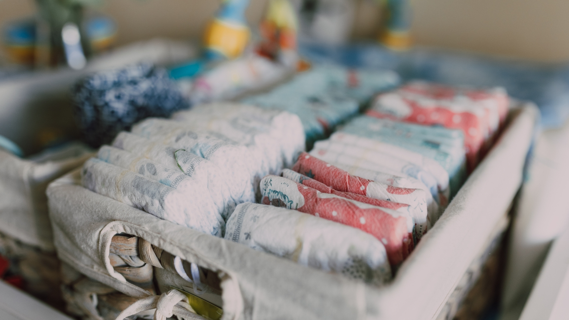 table with baby supplies like diapers and wipes