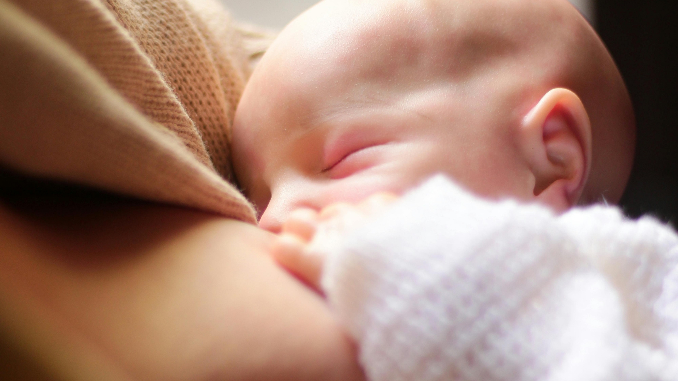 mother breastfeeding baby