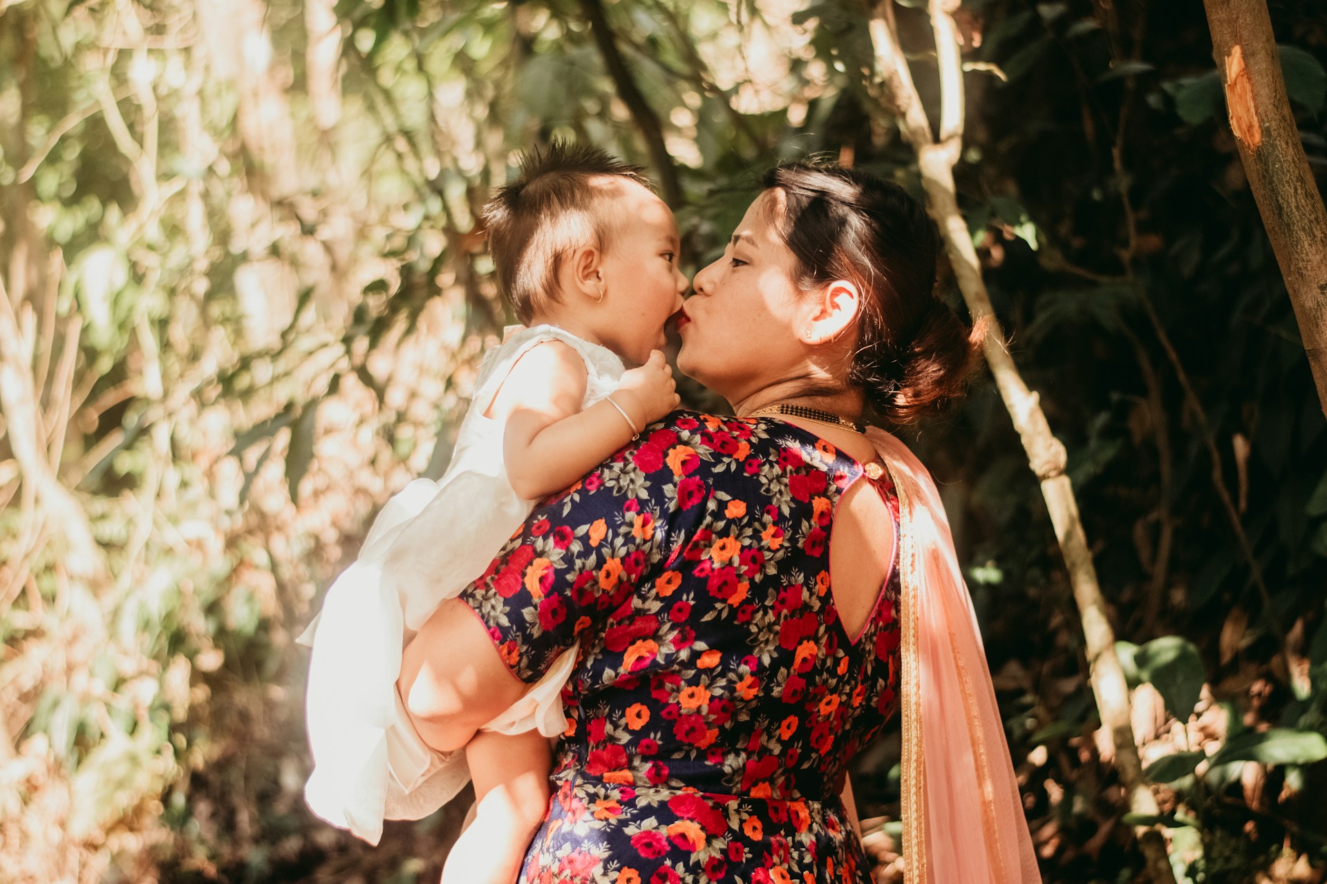 mother and baby outside in summer