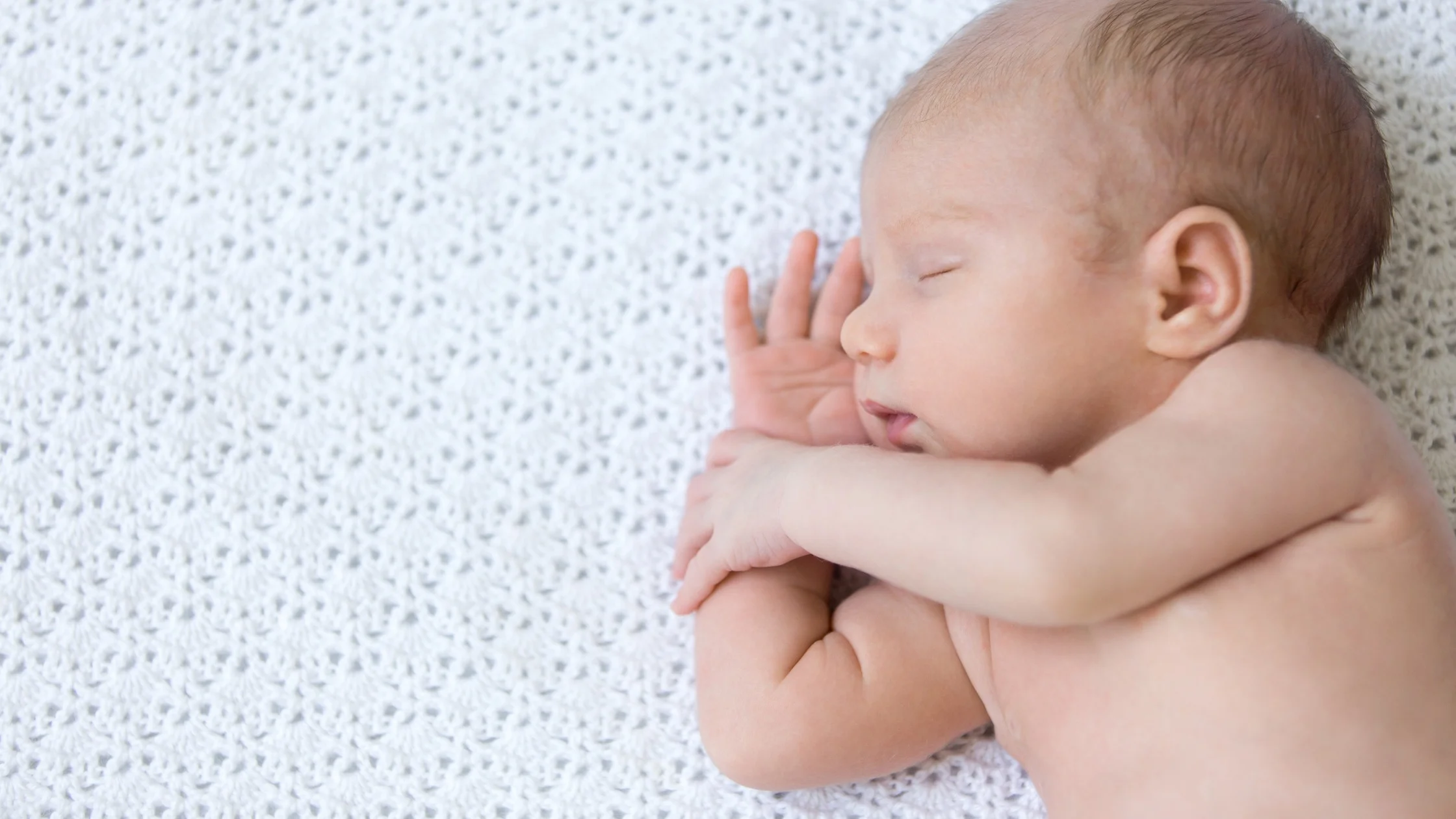 newborn sleeping on own
