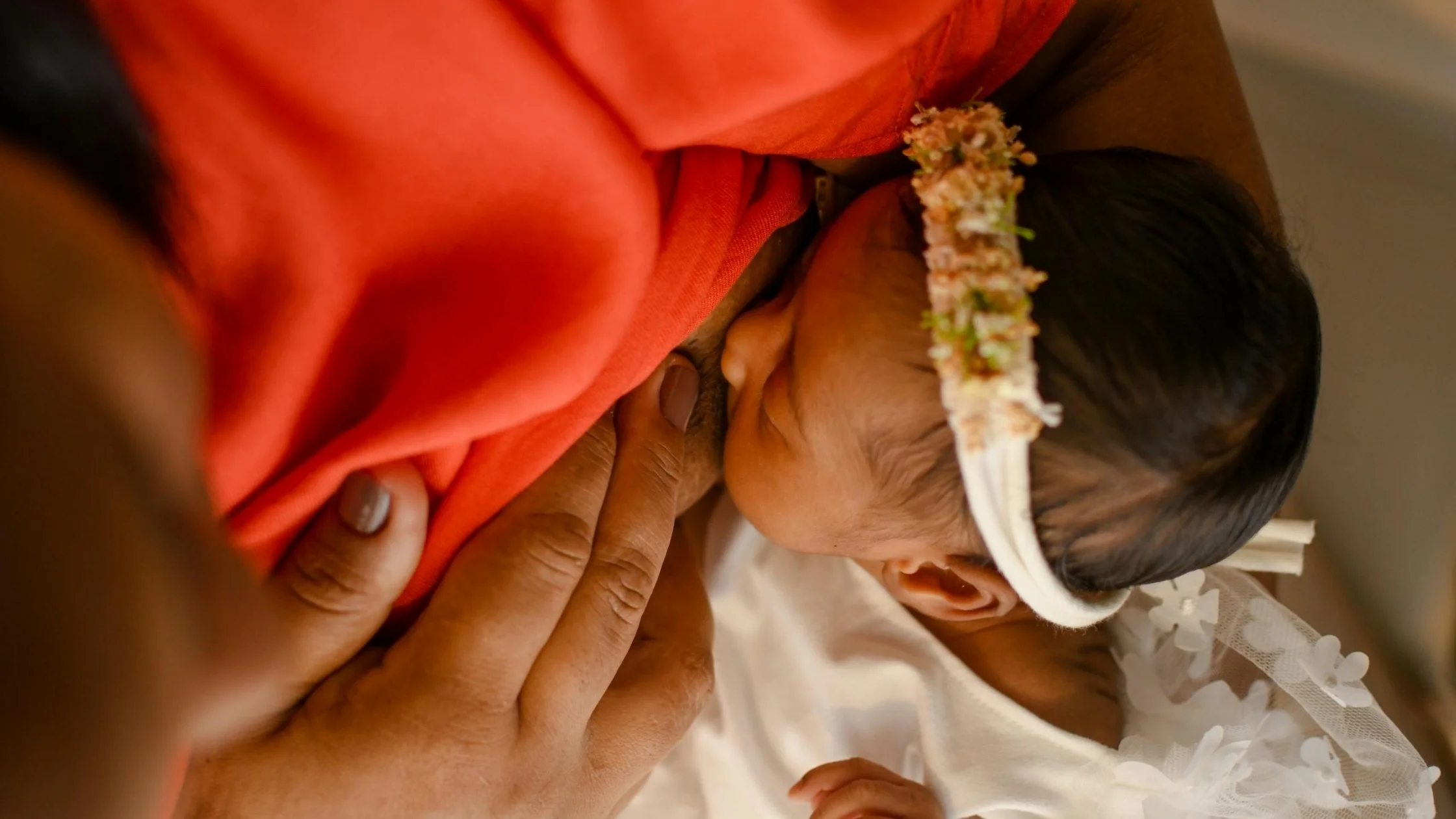 mom breastfeeding baby at night