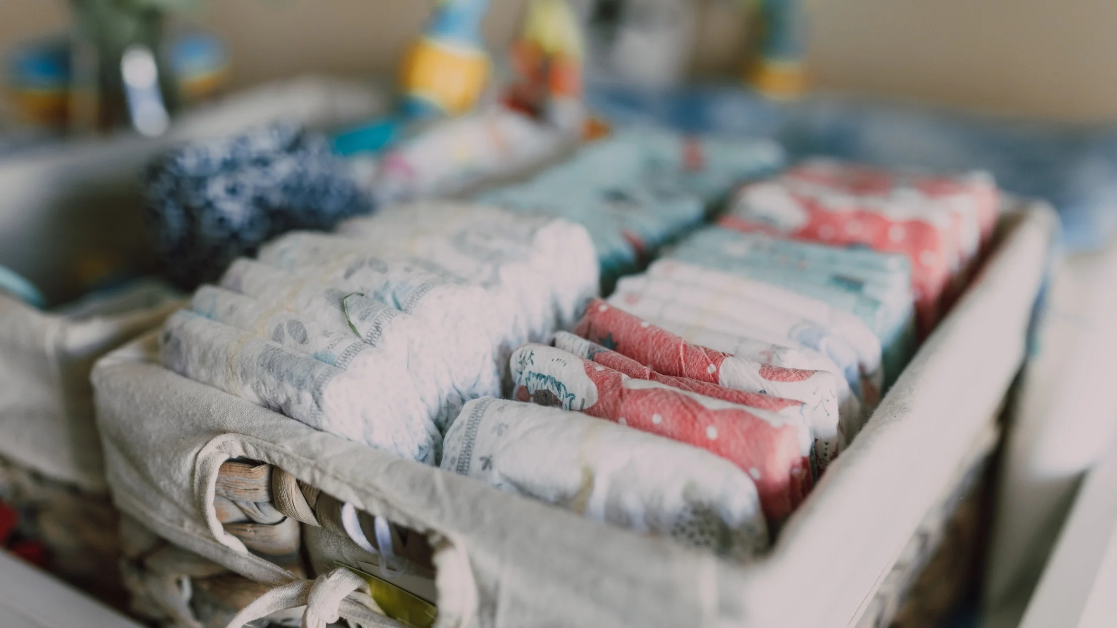 table with baby supplies like diapers and wipes